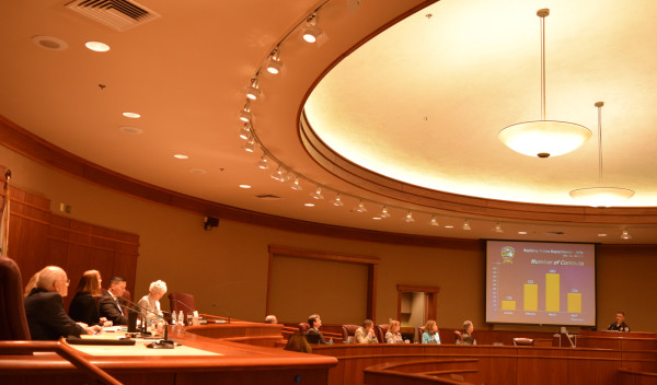Redding City Council members and city staff listen to Paoletti's report. Photo by Jon Lewis.