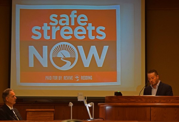 Rocky Slaughter, right, introduces a campaign slogan for the tax measure. 