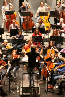 Scott Seaton conducts during a rehearsal with NSS musicians. Photo courtesy of NSS.