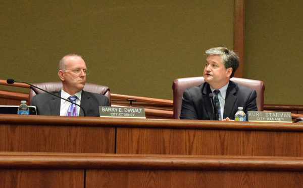 City Attorney Barry DeWalt, left, listens as City Manager Kurt Starman discusses the reserve fund.