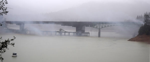Smoke clears to reveal the stubborn southern span is still intact.