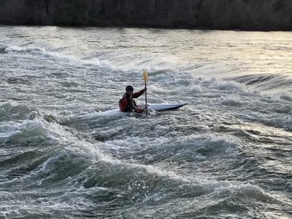 A lone kayaker rides the waves at the ACID dam near Caldwell Park in Redding. Photo by Jon Lewis. 