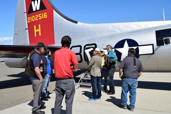 Cong. Doug LaMalfa (blue shirt, sunglasses) chats with passengers.